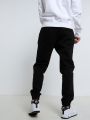 מכנסי טרנינג עם פאץ' לוגומכנסי טרנינג עם פאץ' לוגו של CHAMPION image №4