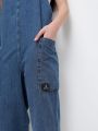  אוברול ג'ינס עם כיסים של URBAN OUTFITTERS