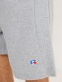  מכנסי טרנינג עם לוגו / גברים של RUSSELL ATHLETIC