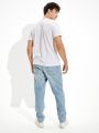  ג'ינס ארוך בשטיפה בהירה בגזרת 90'S של AMERICAN EAGLE