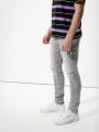  ג'ינס סקיני עם שיפשופים של AMERICAN EAGLE