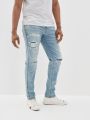  מכנסי ג'ינס עם שיפשופים Athletic Fit של AMERICAN EAGLE