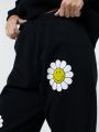  מכנסי טרנינג עם הדפס ®SMILEY בדוגמאת פרחים של TERMINAL X