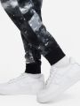  מכנסי טרנינג בהדפס לוגו Nike Sportswear Club Fleece של NIKE