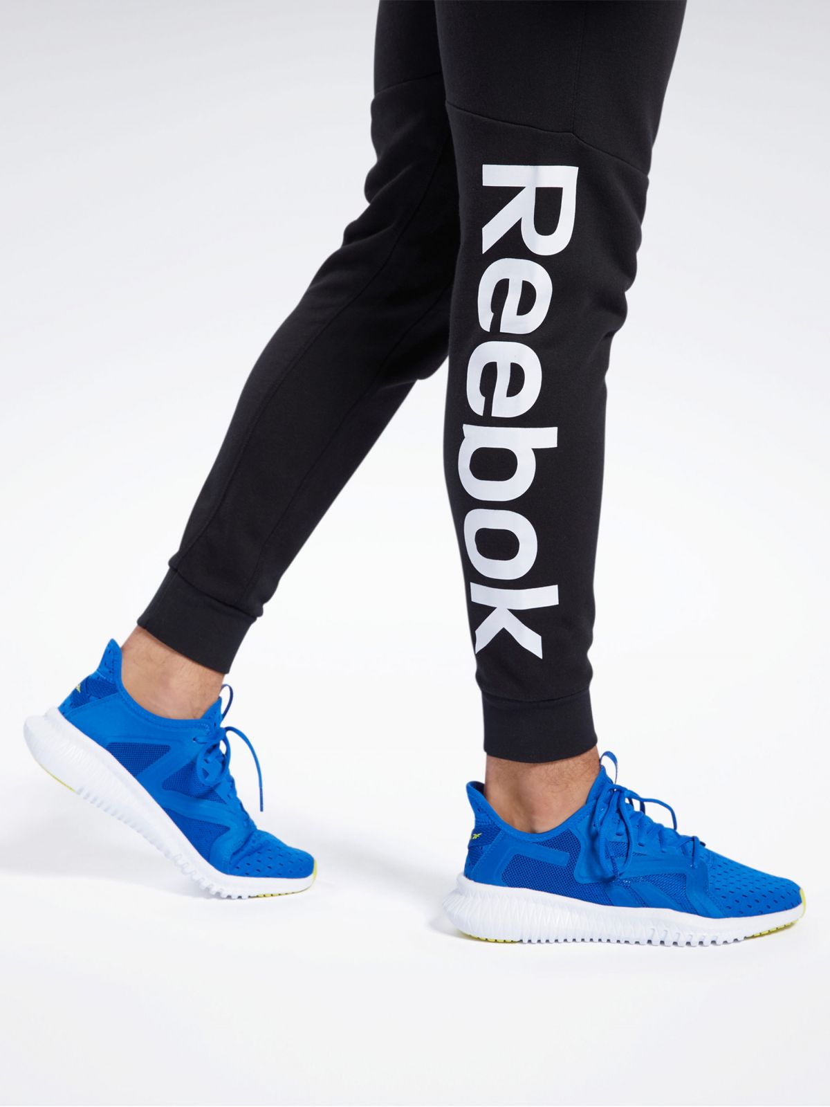  מכנסי טרנינג ארוכים עם הדפס לוגו של REEBOK