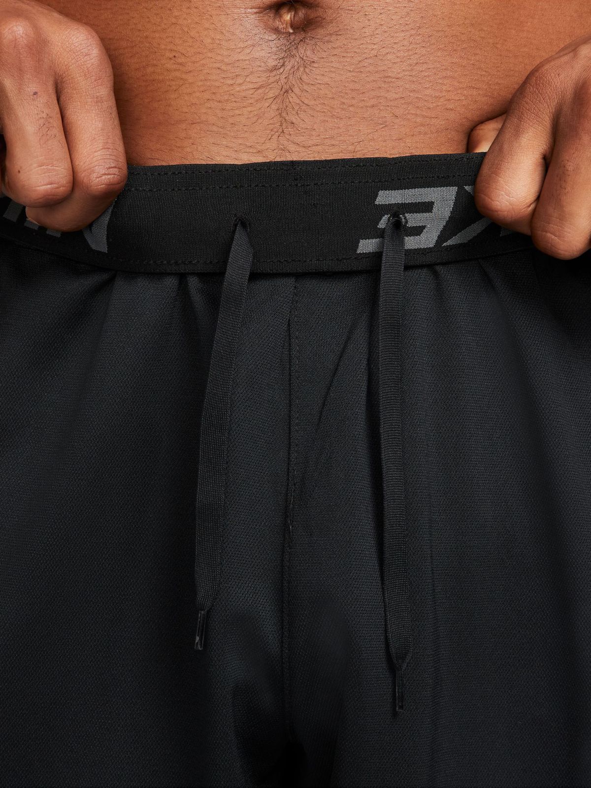  מכנסי אימון Dri-FIT עם לוגו של NIKE